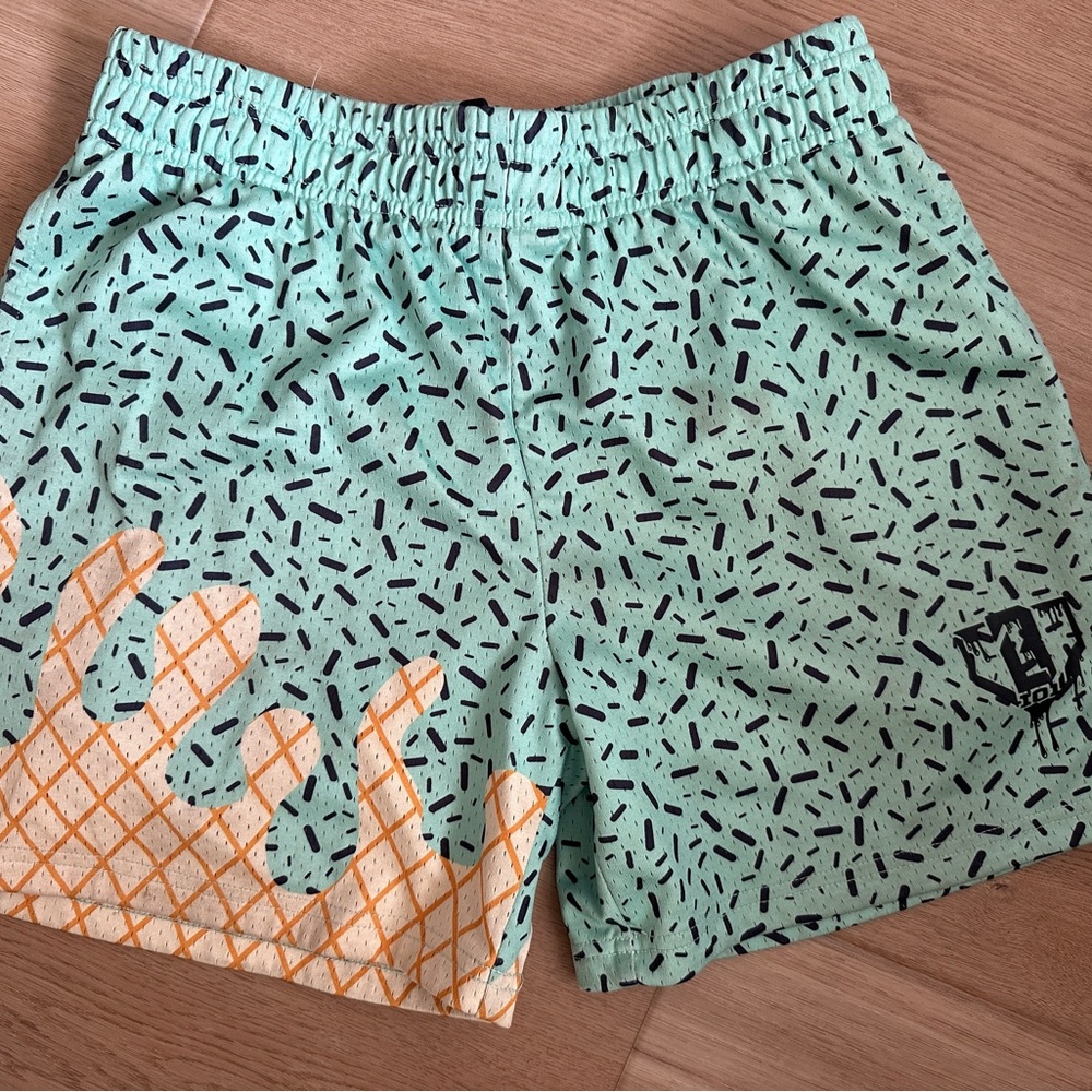 Kids Mint Green Swim Shorts with Orange Graphic